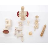 Group of 19th century carved ivory or bone sewing accessories - to include ivory clamps,