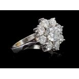 Fine diamond cluster ring, the flower-head cluster comprising nine brilliant cut diamonds,