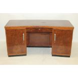 Art Deco walnut veneered desk of architectural curved form,