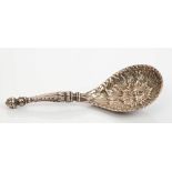 Fine quality Victorian silver caddy spoon with teardrop bowl with embossed face mask decoration and