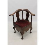 George II walnut corner chair with shaped bar back raised on solid vase splats and columns,