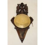 Highly unusual and finely carved oak heraldic shield,
