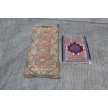 Small Persian rug with angular blue and red medallion within cream ground and borders,