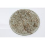 19th century Chinese carved green jade circular panel, finely pierced with leaf scrollwork,