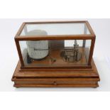 Early 20th century honey oak cased Tycos barograph in glazed case, with silvered instruction plaque,
