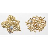 Two 1970s yellow metal brooches of abstract form, set with diamond,