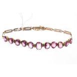 Pink tourmaline bracelet with eleven oval cut pink tourmalines,