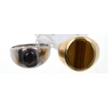 Yellow metal and tiger's eye signet ring and a white metal signet ring,