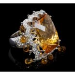 Unusual diamond and orange stone cocktail ring, the large rectangular mixed cut stone,