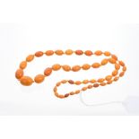Old amber necklace with a string of graduated oval amber beads,