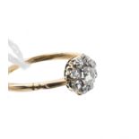 Victorian diamond cluster ring with a flower-head cluster of nine old cut diamonds in claw setting,
