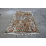 Large Chinese rug with central circular medallion and scrolling acanthus on bronze ground within