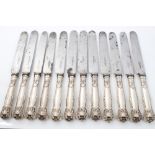 Set of six early Victorian table knives with silver Kings pattern handles and steel blades,