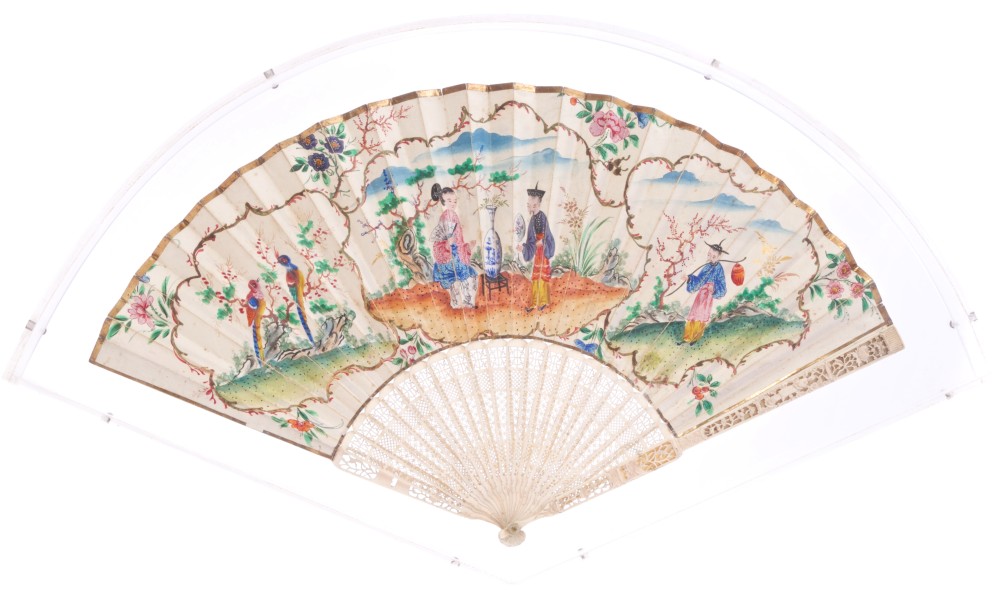 19th century carved Canton ivory and painted paper fan with finely lattice pierced sticks and
