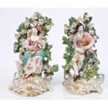 Pair of 18th century Derby figures of musicians with lamb and floral bocage,
