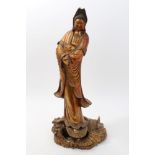 Large Chinese and giltwood figure of Guanyin in contemplative pose, holding a vessel,