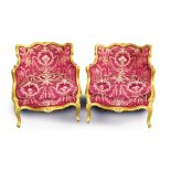 Pair of late 19th century French giltwood tub chairs with floral carved decoration,