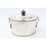 19th century white metal tea caddy of oval form, with bead borders,