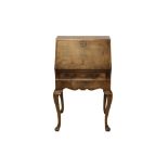 Good George I-style walnut crossbanded and feather-banded bureau of diminutive proportions,