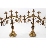 Pair of Victorian gothic brass candlesticks,