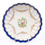 18th century Worcester fluted saucer dish painted with an exotic bird and gilt garlands, circa 1775,