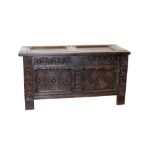 Late 17th century carved oak coffer with dual-panel hinged lid on dual-panel front,