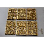 Chinese carved red and gilt lacquered sectional frieze with six elements,