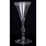 Fine Georgian wine glass with slim trumpet bowl with floral engraved rim,