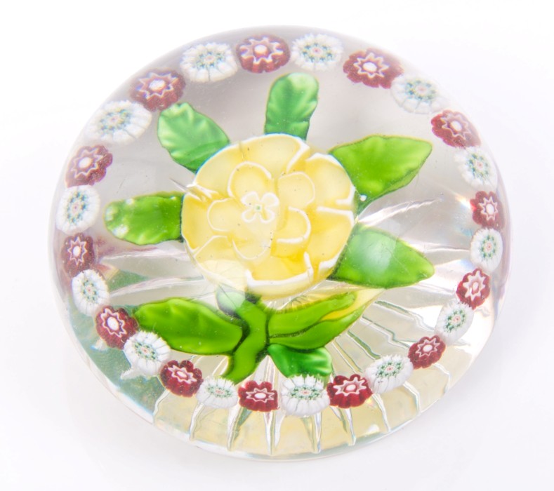 Mid-19th century Baccarat glass paperweight with yellow and white double primrose with green petal