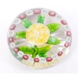 Mid-19th century Baccarat glass paperweight with yellow and white double primrose with green petal