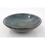 Chinese Cizhou type blue and brown glazed pottery shallow bowl raised on circular foot with pooled