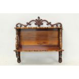 Good quality Victorian mahogany hanging shelves with C-scroll pediment and two shelves between