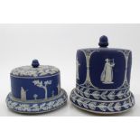 Two Victorian Wedgwood blue Jasper ware stilton domes and bases with classical figure decoration