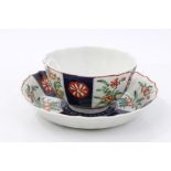 18th century Worcester Kakiemon palette fluted tea bowl and saucer with floral and mon decorated