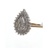 Diamond pear-shape cluster ring with eight central brilliant cut diamonds surrounded by baguette