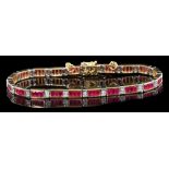 Gold (18ct) diamond and synthetic ruby bracelet with an articulated line of rectangular step cut
