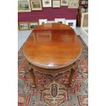 1920s mahogany oval extending dining table with gadrooned top raised on shell carved cabriole legs,