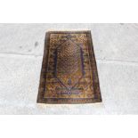 Persian rug with long serated medallion within borders on bronze ground with tassel ends,