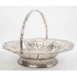 George V silver bread basket of flared oval form, with pierced decoration and ropework border,