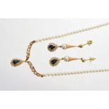 Sapphire and diamond cluster pear-shape pendant necklace suspended from a string of cultured pearls,