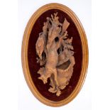 Large 19th century Black Forest carved lindenwood plaque in the form of a hunting trophy,