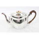 George III silver teapot of fluted form, with bright cut foliate decoration,