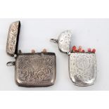 Late Victorian silver vesta case of oval form, with engraved foliate decoration and initials,