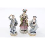 Pair of 19th century Meissen porcelain figures of flower sellers with blue and white and gilt