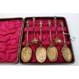 Unusual set of Victorian silver plated and gilt metal serving spoons - comprising four large spoons