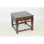 Chinese hardwood table with square crossbanded top on pierced frieze and square supports,