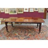 Victorian mahogany extending dining table with rounded rectangular top,