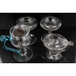 Pair Georgian lacemakers' glass oil lamps with shallow circular bowls and spiral-twist stems,