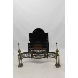 19th century cast iron brass and steel fire basket of serpentine form,