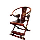 Impressive Chinese carved hardwood and brass mounted X-form horseshoe chair with good patination,